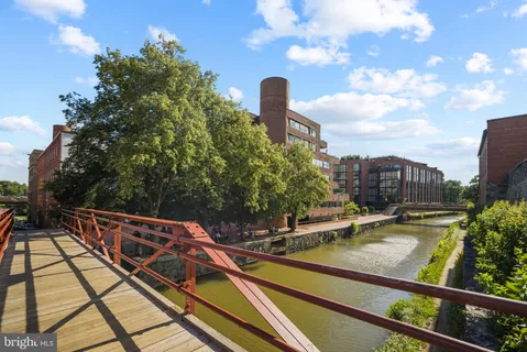 a view of building with yard and staircase