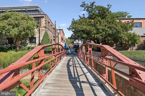 a view of a swimming pool with a yard