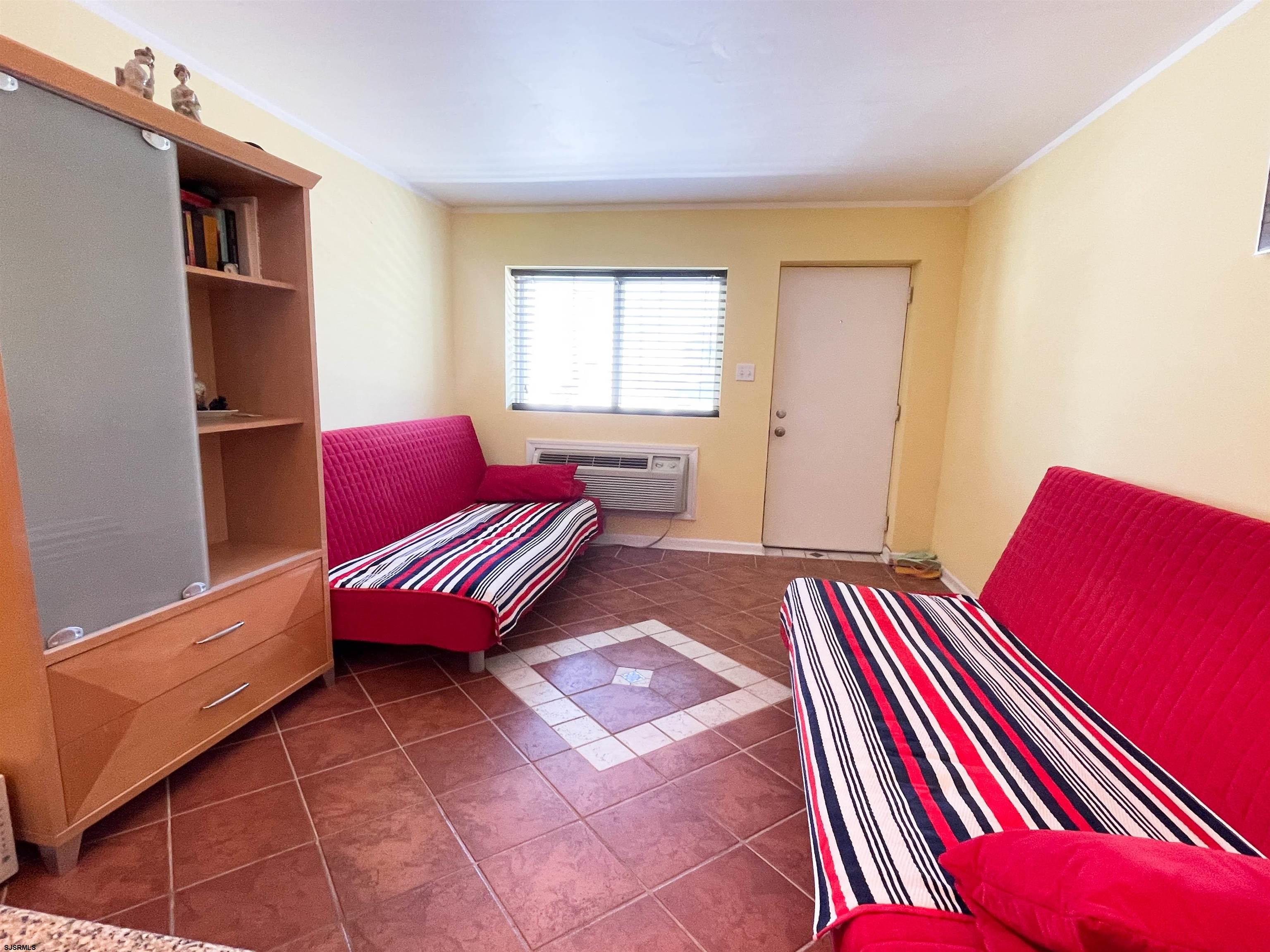 9201 Atlantic Avenue, Unit 2 Margate City, NJ 08402 - Photo 13 of 13 a bedroom with furniture and a window