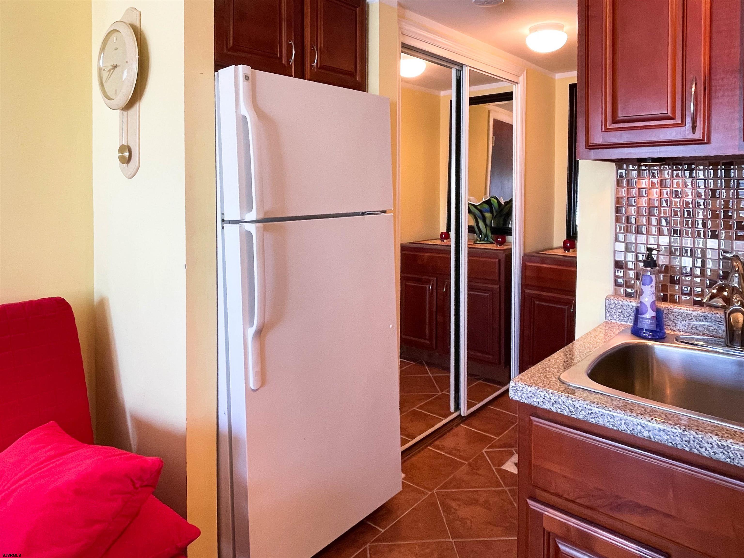 9201 Atlantic Avenue, Unit 2 Margate City, NJ 08402 - Photo 9 of 13 a kitchen with a refrigerator and a sink