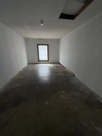 a view of an empty room and window