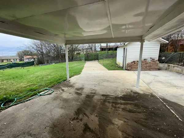 a view of a backyard with porch