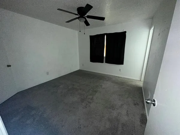 a view of a big room with carpet