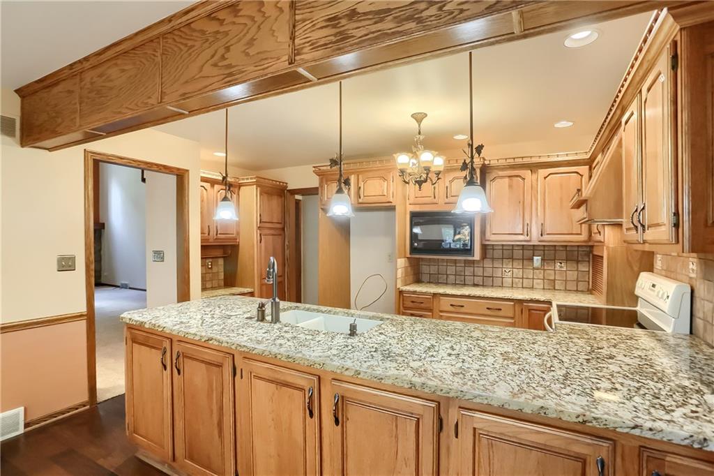 2901 Rosedale Avenue New Castle, PA 16105 - Photo 14 of 25 a bathroom with a granite countertop sink and a mirror