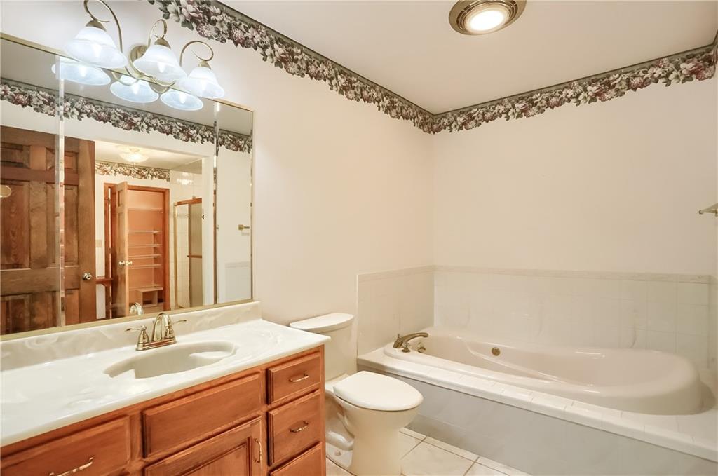 2901 Rosedale Avenue New Castle, PA 16105 - Photo 18 of 25 a bathroom with a sink double vanity and a bathtub