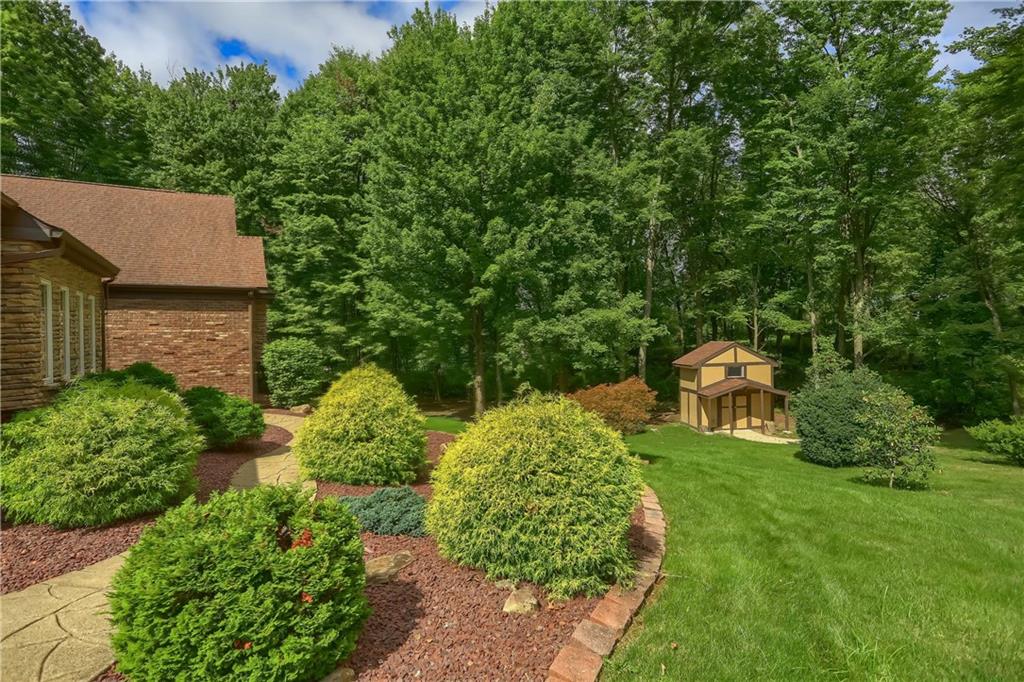 2901 Rosedale Avenue New Castle, PA 16105 - Photo 5 of 25 a backyard of a house with outdoor seating and green space