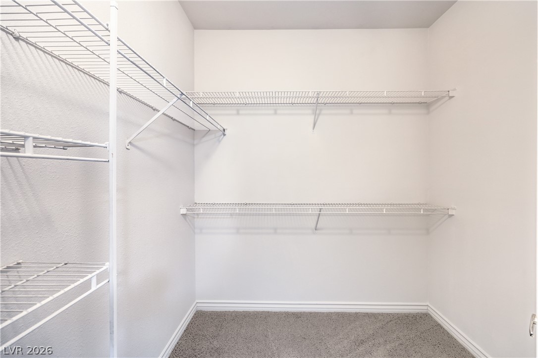 2050 West Warm Springs Road, Unit 1421 Henderson, NV 89014 - Photo 28 of 45 Ample wire shelving provides practical storage within this carpeted walk-in closet.