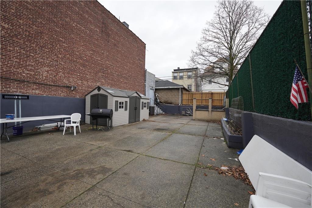 347 78th Street Brooklyn, NY 11209 - Photo 2 of 2 a view of a patio with table and chairs and potted plants