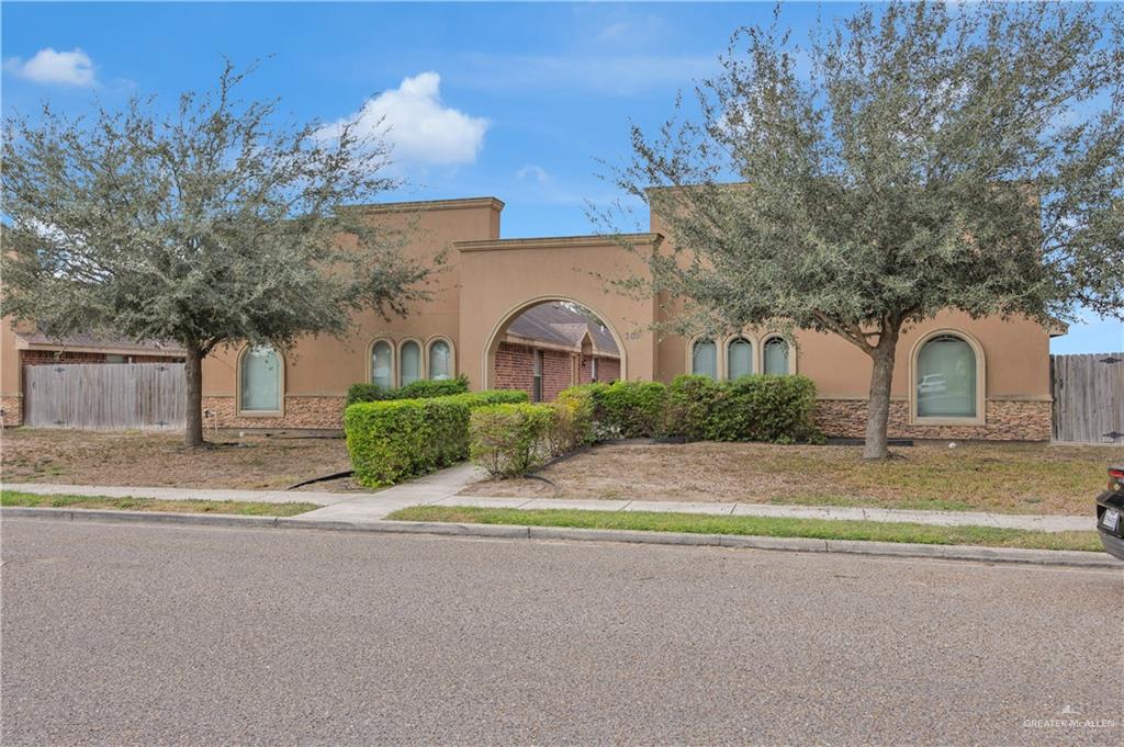 303 Baltic Avenue, Unit 2 Edinburg, TX 78539 - Photo 2 of 6 a front view of a house with a yard and garage