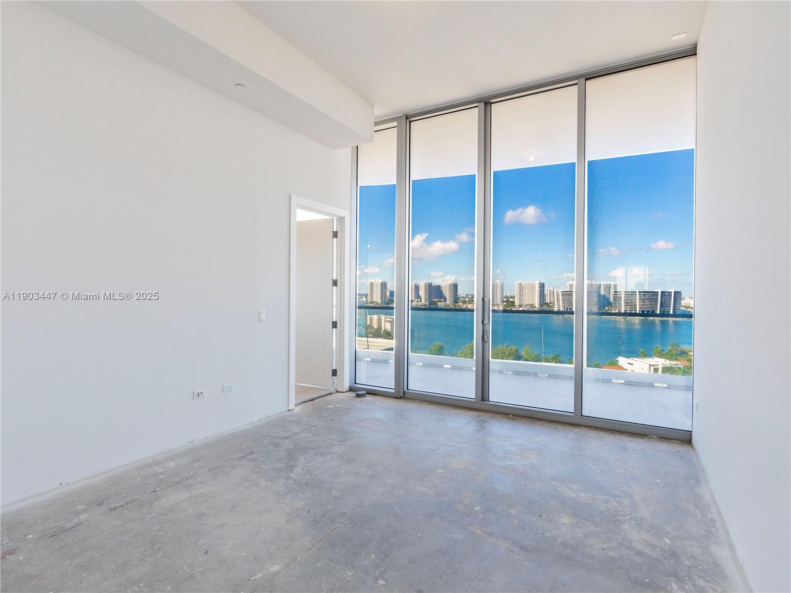 18501 Collins Avenue, Unit 1501 Sunny Isles Beach, FL 33160 - Photo 14 of 35 a view of an empty room with glass door