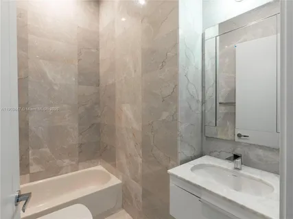 a bathroom with a sink and a bathtub