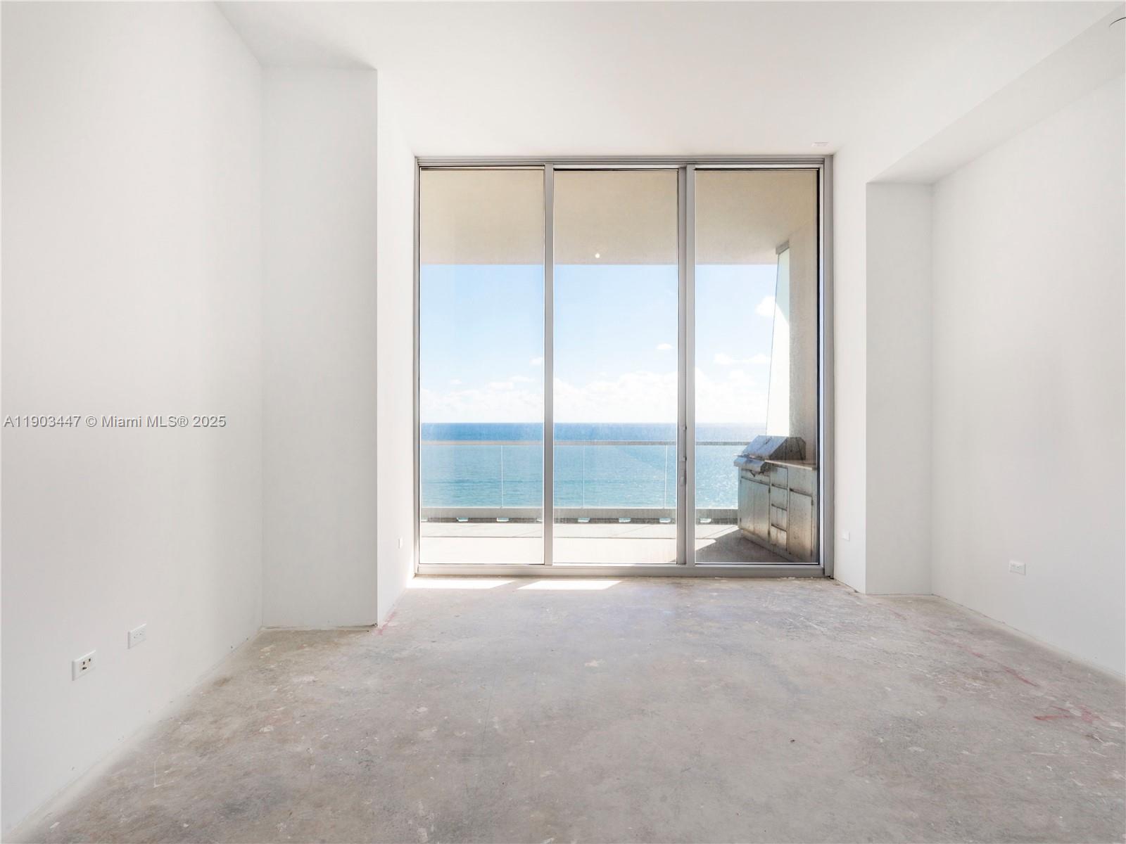 18501 Collins Avenue, Unit 1501 Sunny Isles Beach, FL 33160 - Photo 10 of 35 a view of an empty room with a window