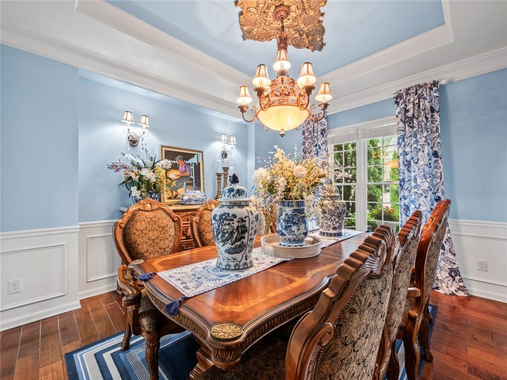 7060 Summit Ridge Chase Cumming, GA 30041 - Photo 15 of 58 a view of a dining room with furniture window and wooden floor