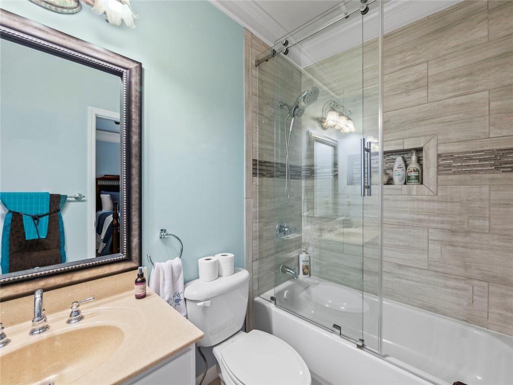 7060 Summit Ridge Chase Cumming, GA 30041 - Photo 20 of 58 a bathroom with a sink toilet and shower