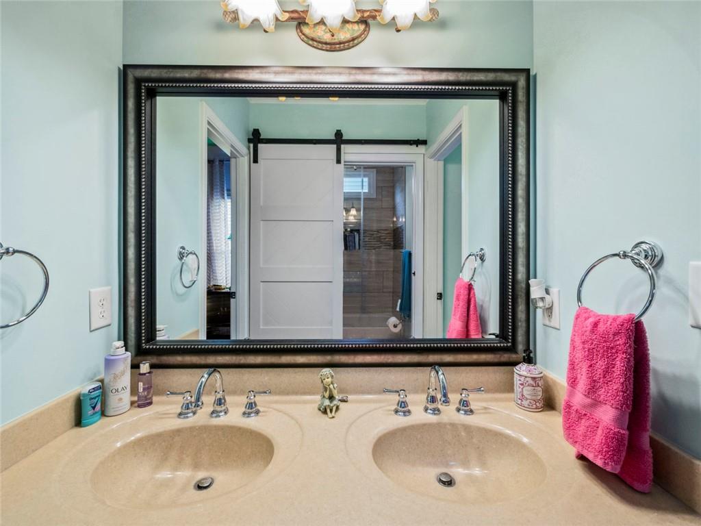 7060 Summit Ridge Chase Cumming, GA 30041 - Photo 23 of 58 a bathroom with a sink and a mirror