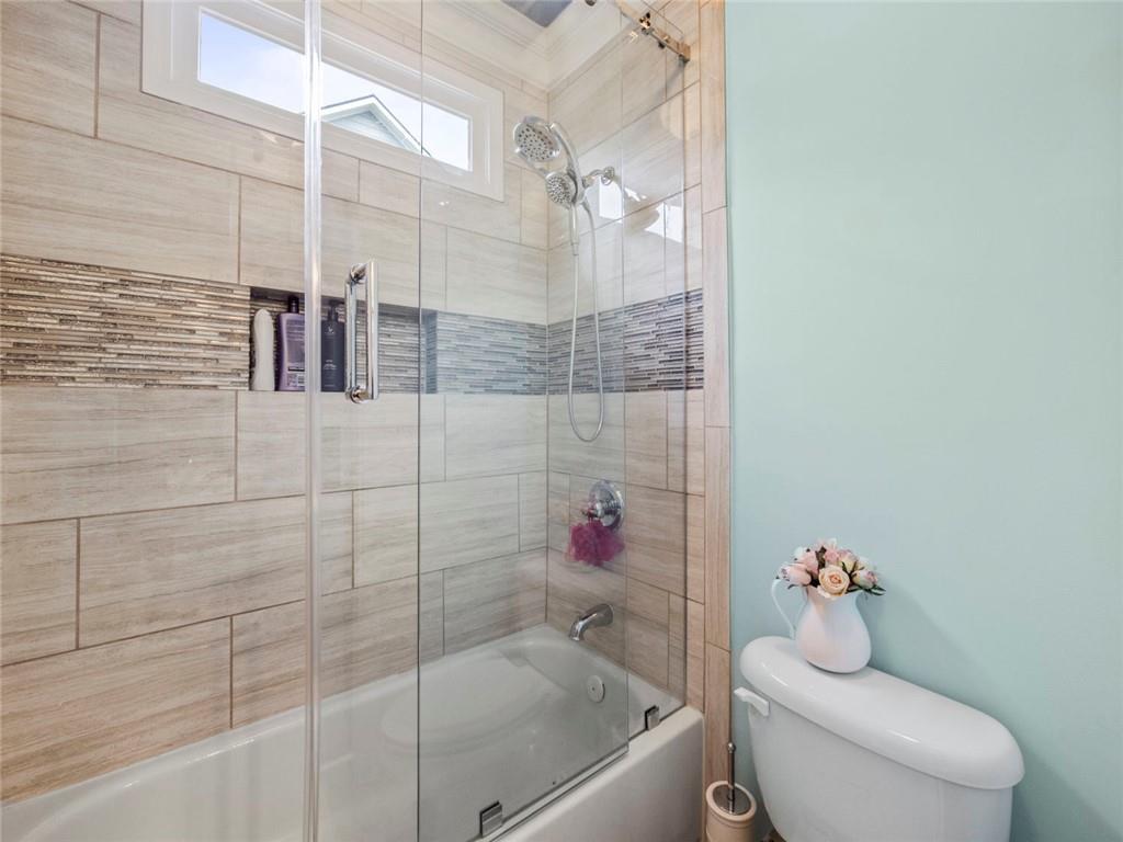 7060 Summit Ridge Chase Cumming, GA 30041 - Photo 24 of 58 a bathroom with a bathtub and shower