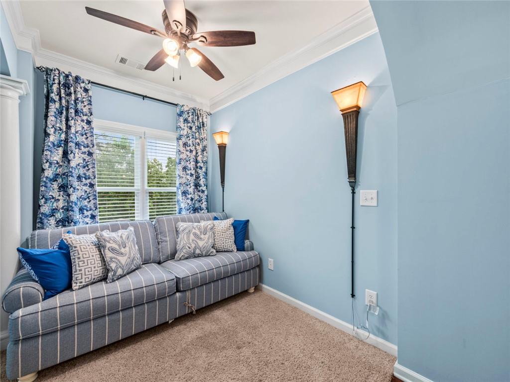 7060 Summit Ridge Chase Cumming, GA 30041 - Photo 27 of 58 a living room with furniture and a large window
