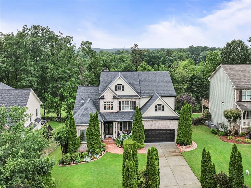7060 Summit Ridge Chase Cumming, GA 30041 - Photo 3 of 58 a aerial view of a house with a big yard plants and large trees