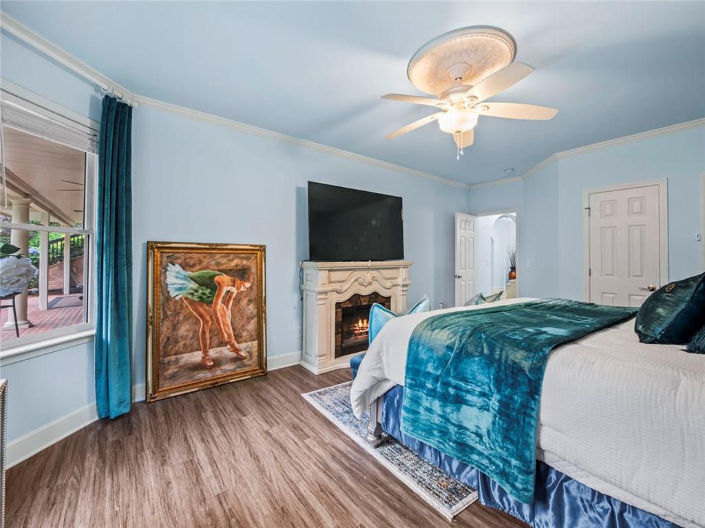 7060 Summit Ridge Chase Cumming, GA 30041 - Photo 33 of 58 a spacious bedroom with a bed and a flat screen tv