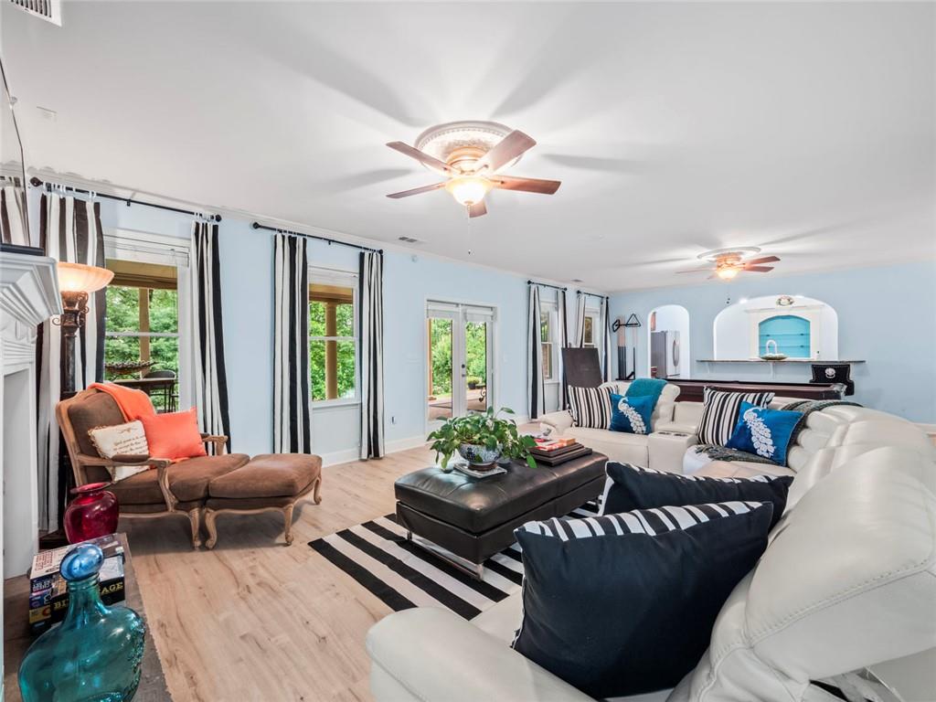 7060 Summit Ridge Chase Cumming, GA 30041 - Photo 34 of 58 a living room with furniture ceiling fan and a window