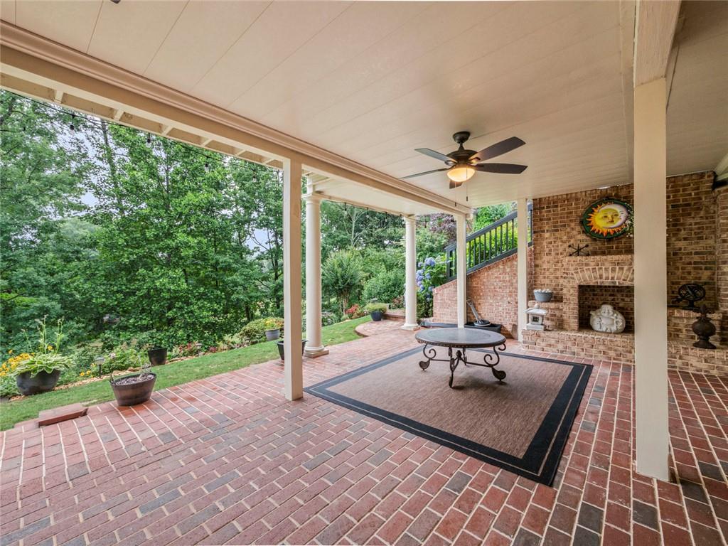 7060 Summit Ridge Chase Cumming, GA 30041 - Photo 38 of 58 a living room with furniture and a large window