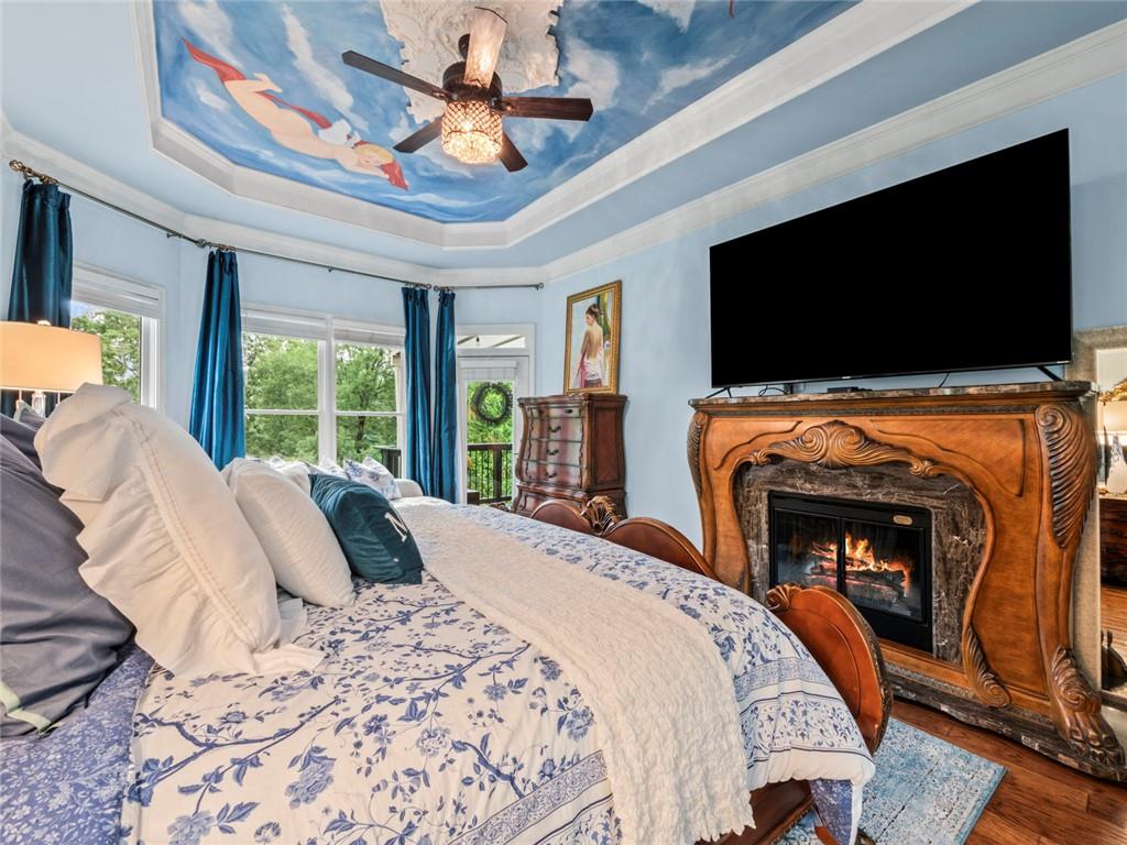 7060 Summit Ridge Chase Cumming, GA 30041 - Photo 40 of 58 a bedroom with a bed and a flat screen tv