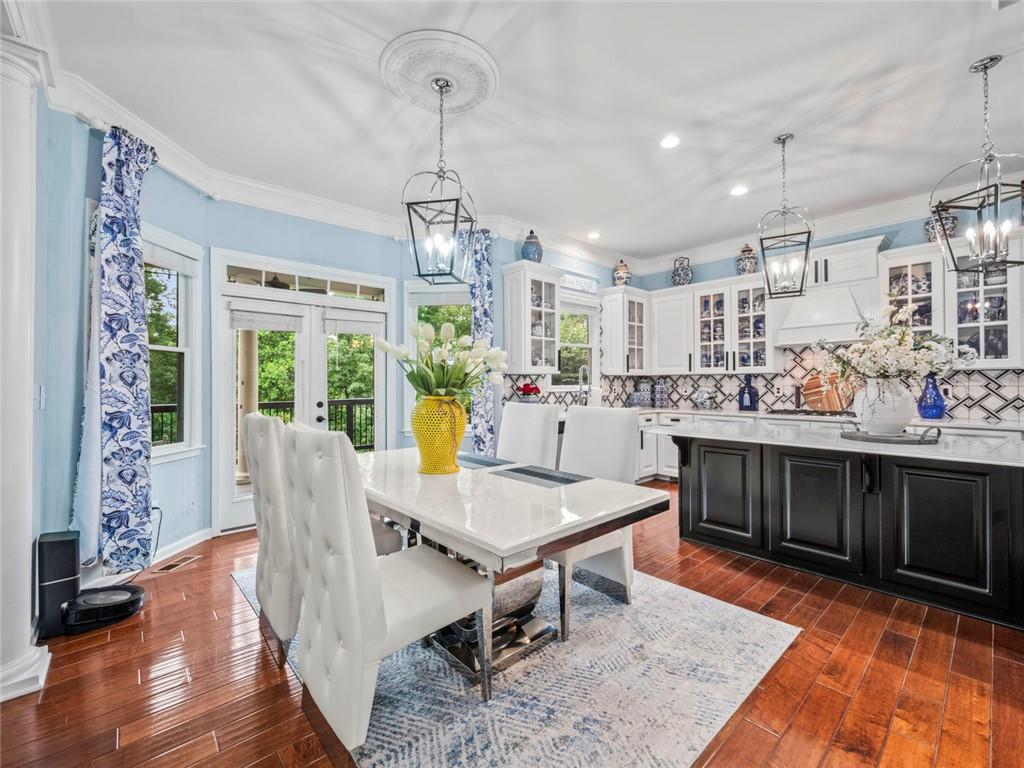 7060 Summit Ridge Chase Cumming, GA 30041 - Photo 46 of 58 a view of a dining room with furniture window and wooden floor