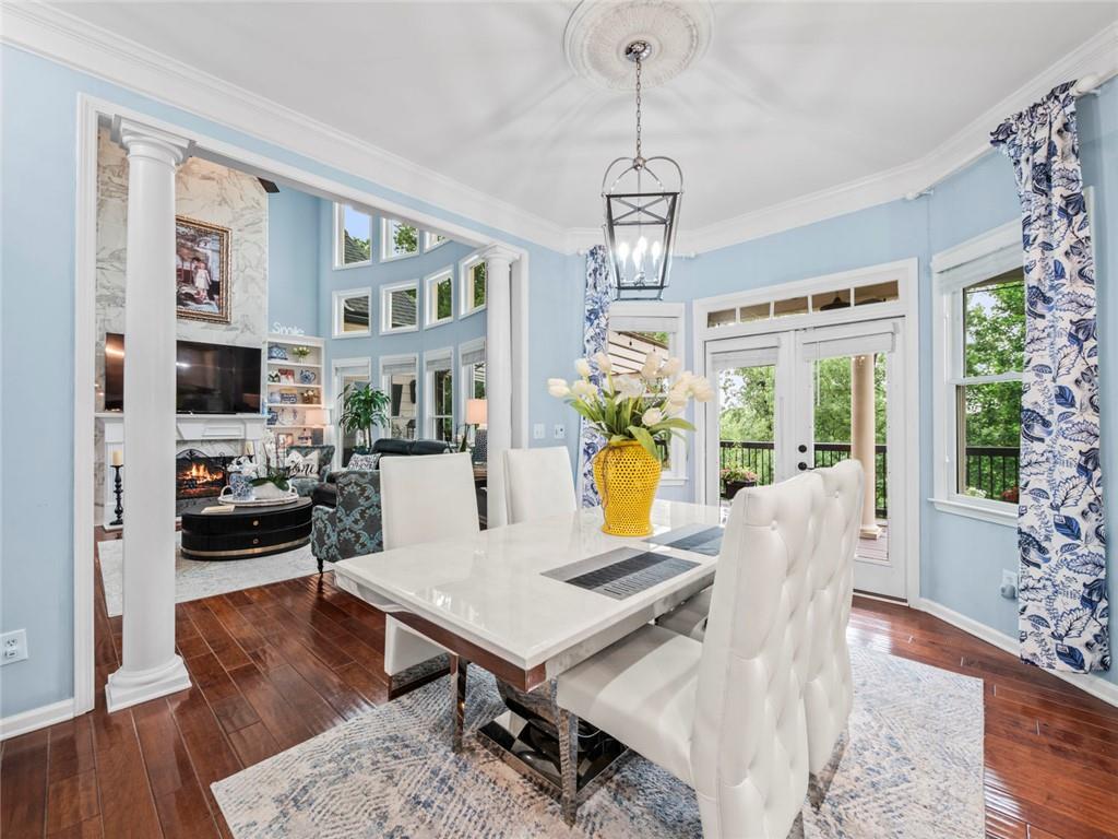 7060 Summit Ridge Chase Cumming, GA 30041 - Photo 48 of 58 a view of a dining room with furniture window and wooden floor