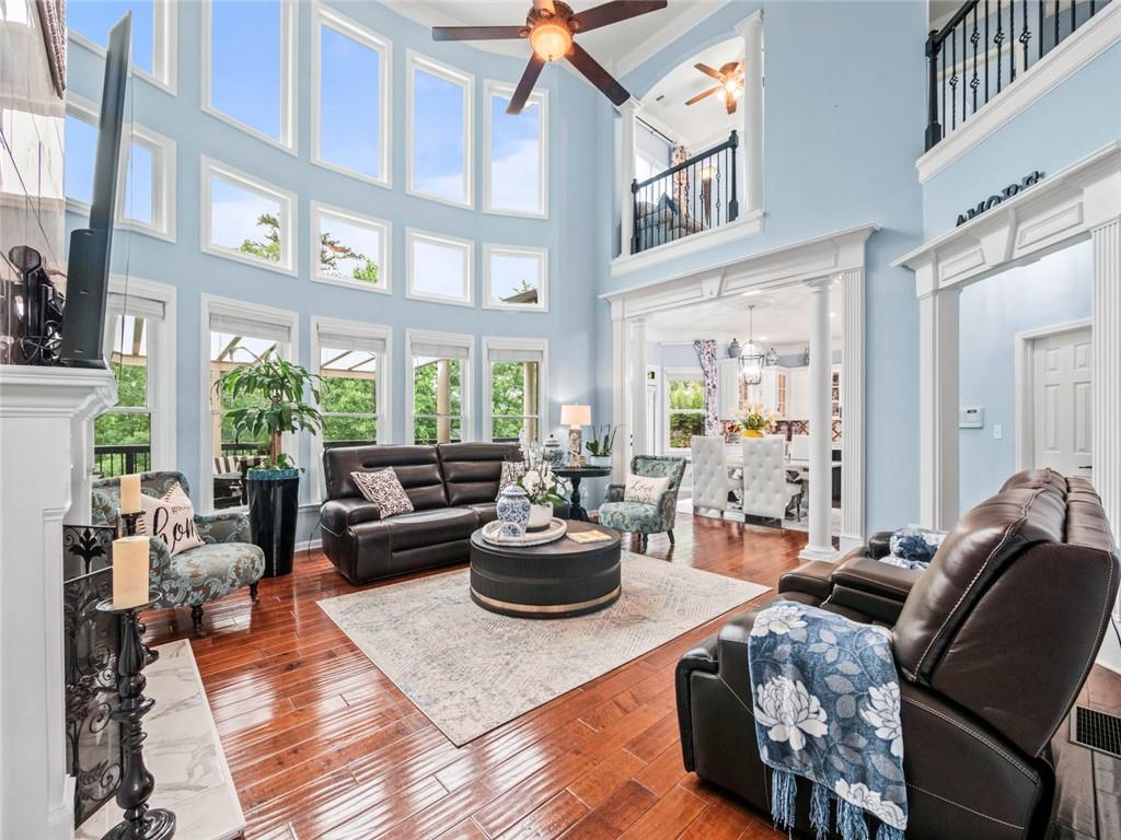 7060 Summit Ridge Chase Cumming, GA 30041 - Photo 50 of 58 a living room with furniture fireplace and a large window