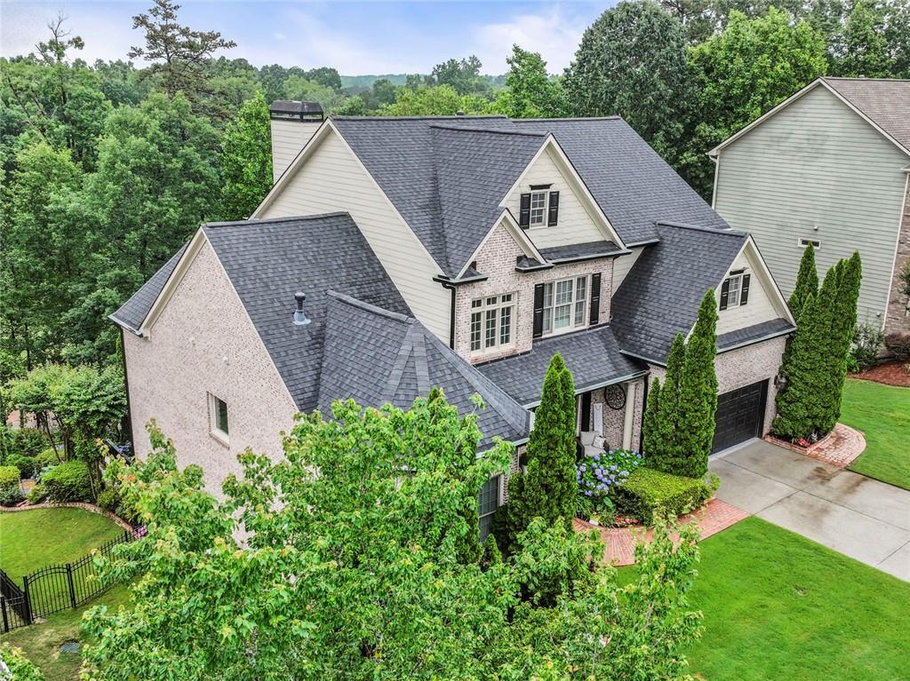 7060 Summit Ridge Chase Cumming, GA 30041 - Photo 5 of 58 an aerial view of a house with a yard and plants