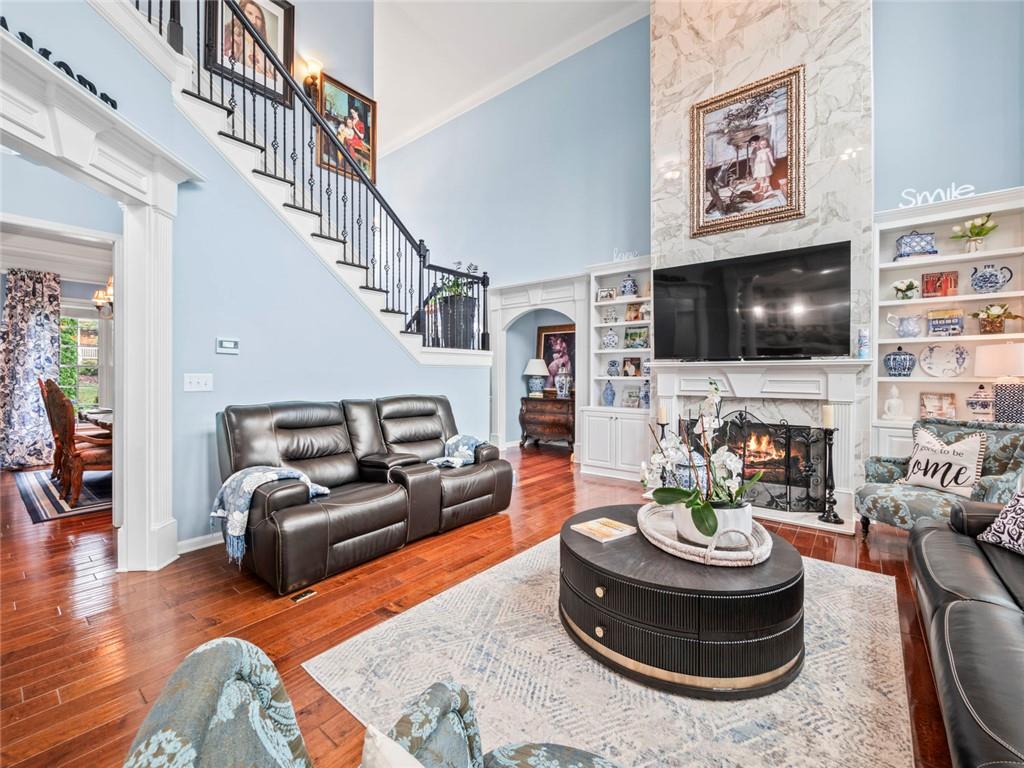 7060 Summit Ridge Chase Cumming, GA 30041 - Photo 51 of 58 a living room with furniture and a flat screen tv