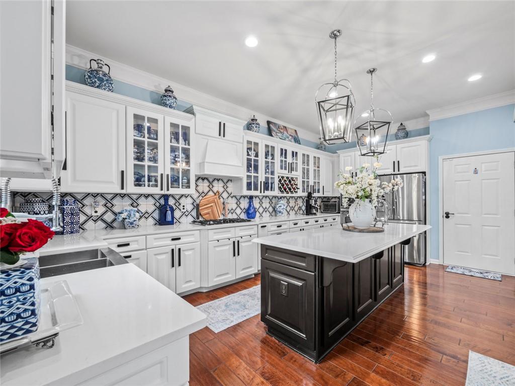 7060 Summit Ridge Chase Cumming, GA 30041 - Photo 54 of 58 a kitchen with a sink stove and cabinets