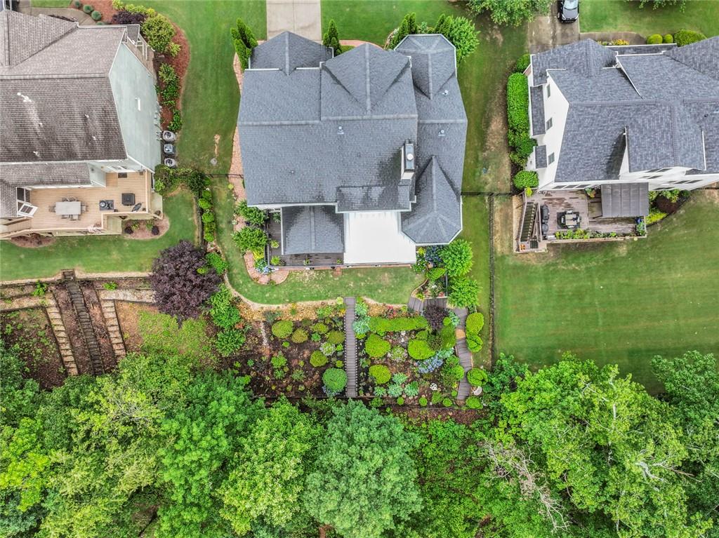 7060 Summit Ridge Chase Cumming, GA 30041 - Photo 9 of 58 an aerial view of a house with garden space and a street view