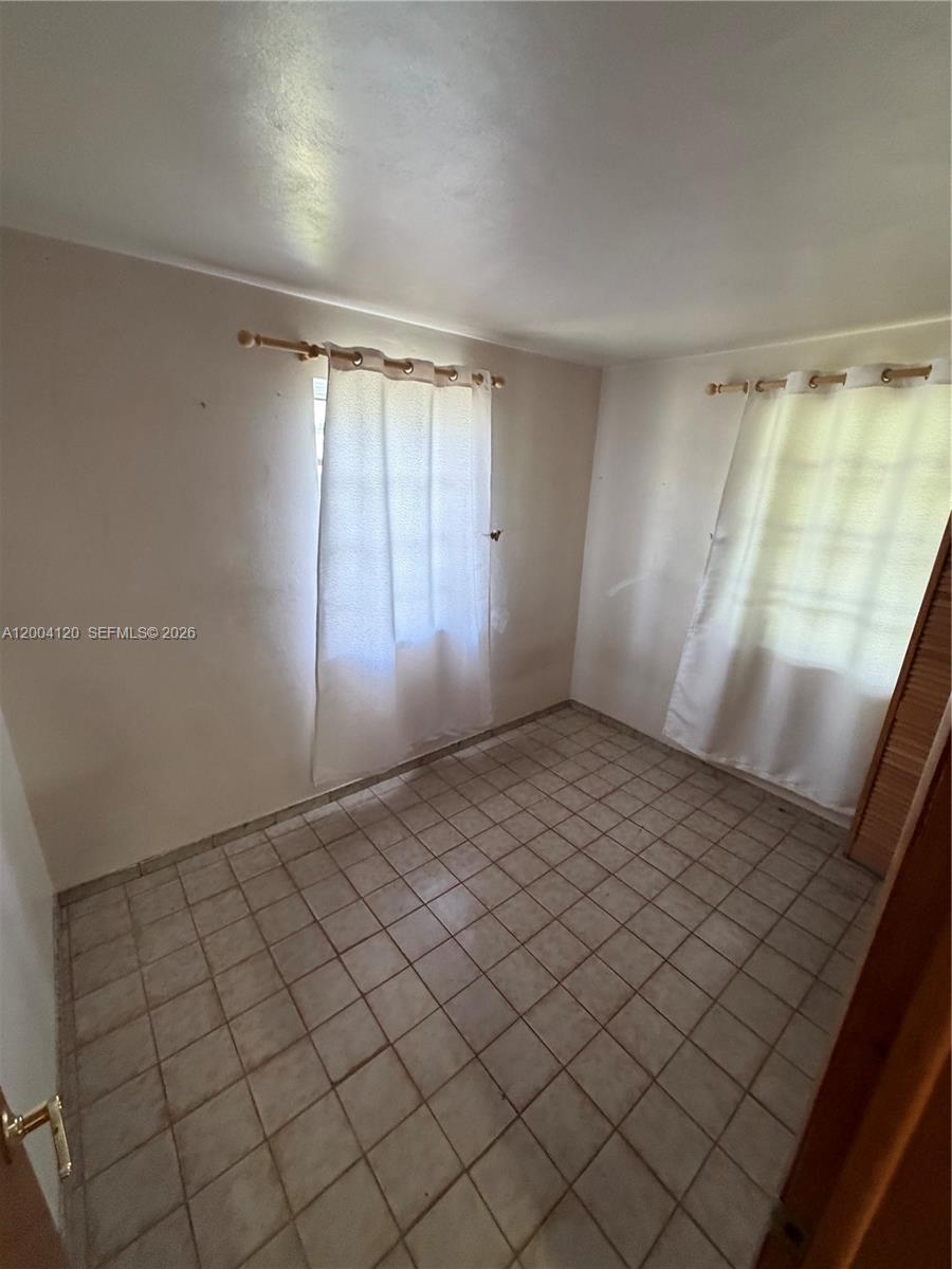 10910 Southwest 40th Street Miami, FL 33165 - Photo 12 of 40 Bedroom #2 downstairs