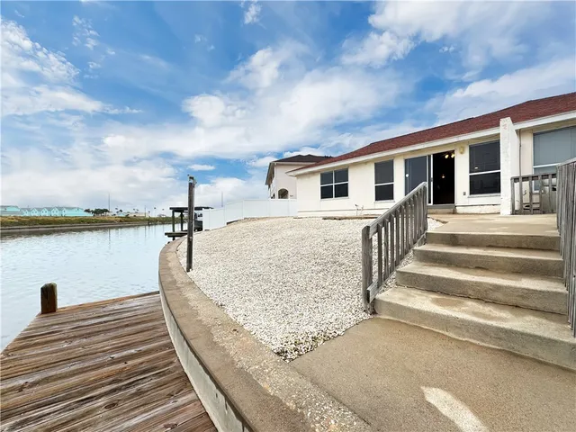 a view of a house with wooden floor and a lake view