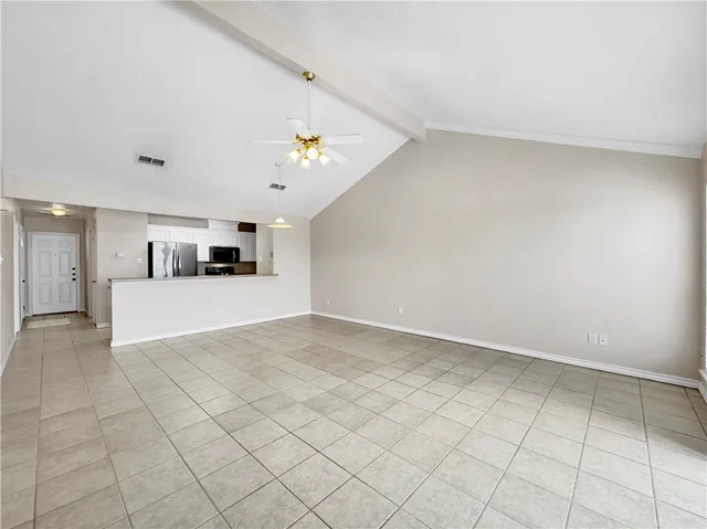 a view of a kitchen with furniture and cabinets