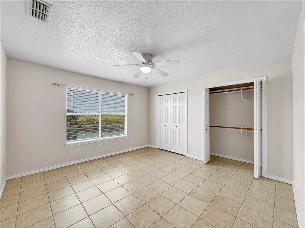 14302 Cruiser Street, Unit B Corpus Christi, TX 78418 - Photo 16 of 25 a view of an empty room with a window