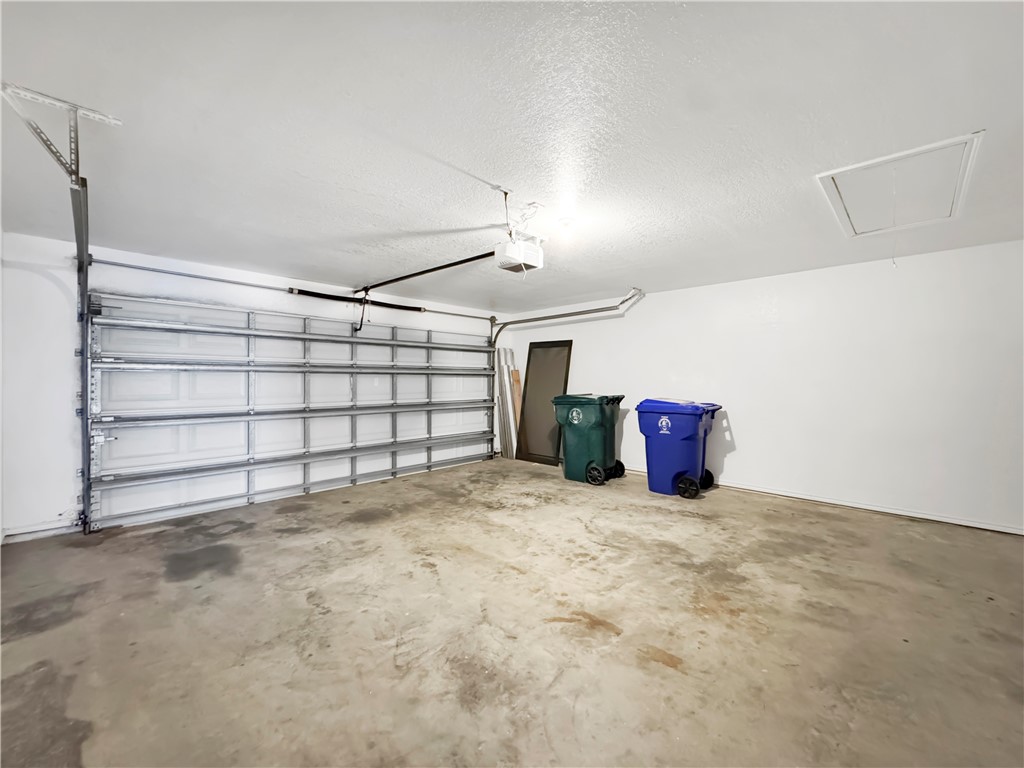 14302 Cruiser Street, Unit B Corpus Christi, TX 78418 - Photo 23 of 25 a view of a garage