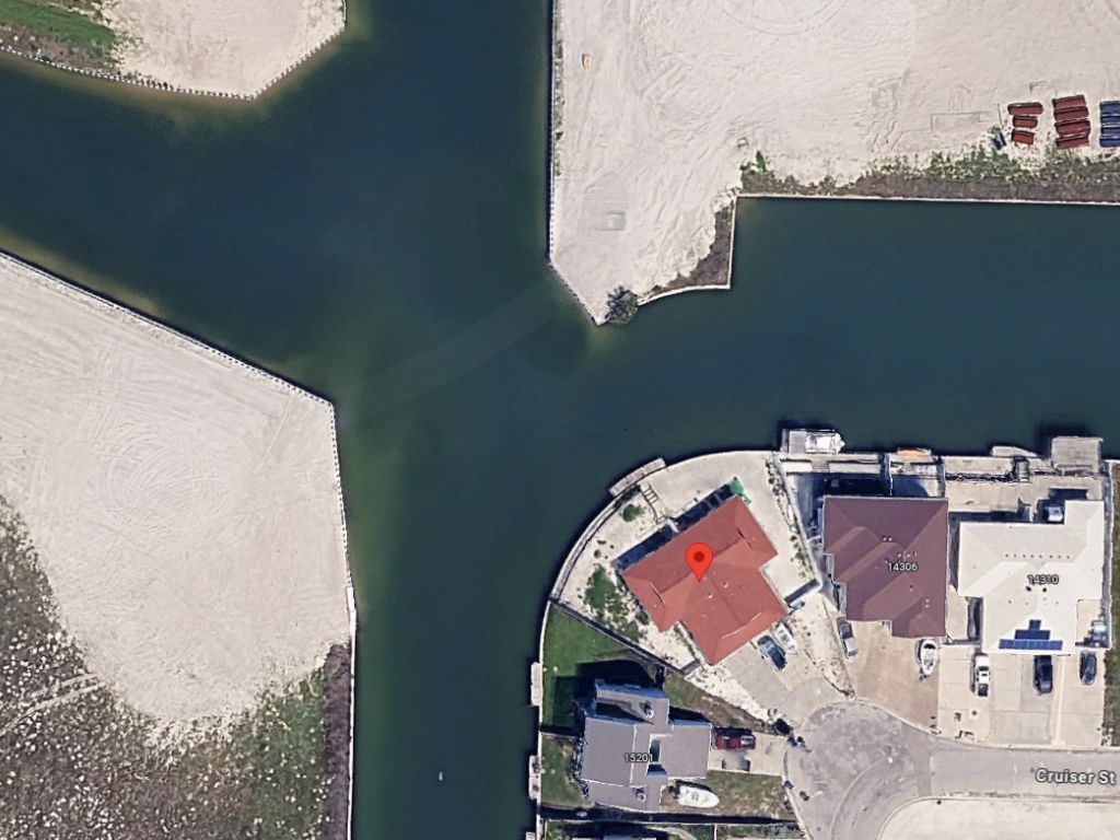 14302 Cruiser Street, Unit B Corpus Christi, TX 78418 - Photo 24 of 25 an aerial view of a house with outdoor space and lake view