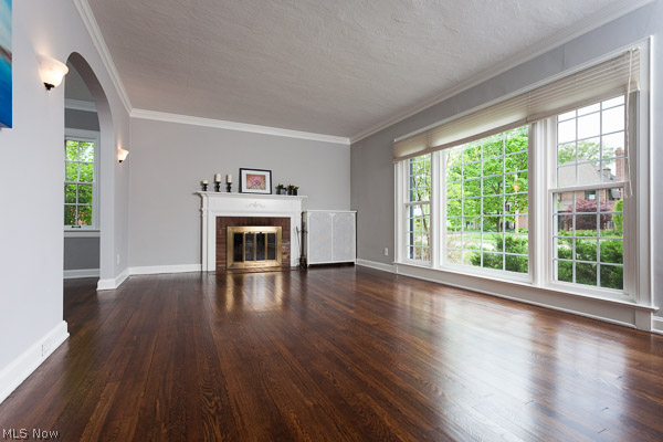 3615 Townley Road Beachwood, OH 44122 - Photo 2 of 13 Sunlight from the larger window invites one along. Crown Molding, newly Refinished Hardwood Floors, and Traditional Fireplace with Mantel are rich details that deepen the home's character.