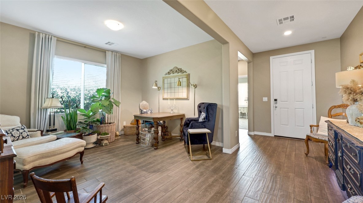1094 Langston Ranch Avenue Henderson, NV 89002 - Photo 13 of 70 Entryway featuring dark wood finished floors and baseboards