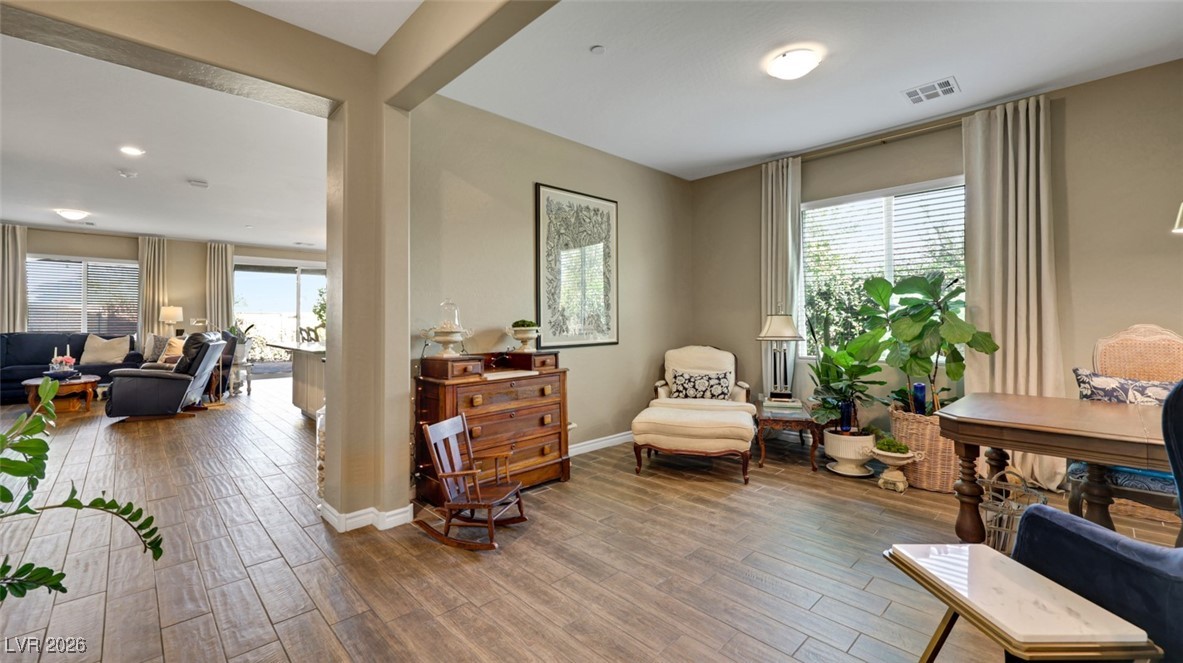 1094 Langston Ranch Avenue Henderson, NV 89002 - Photo 17 of 70 Living area featuring wood finished floors and baseboards