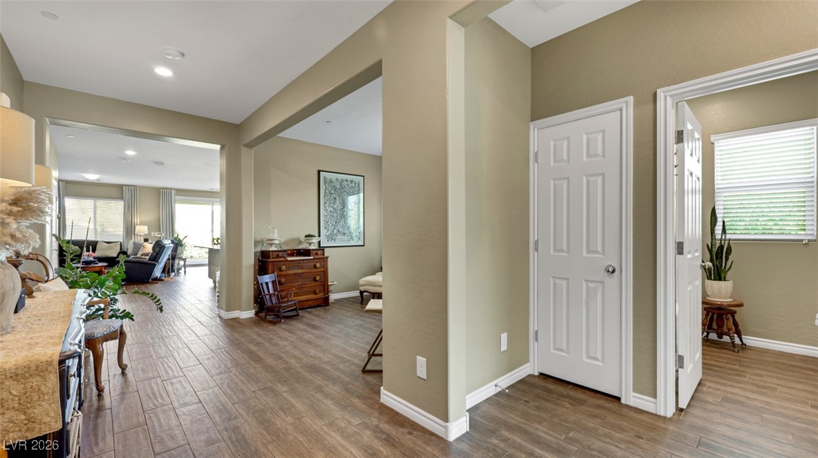 1094 Langston Ranch Avenue Henderson, NV 89002 - Photo 19 of 70 Corridor with dark wood-type flooring and baseboards
