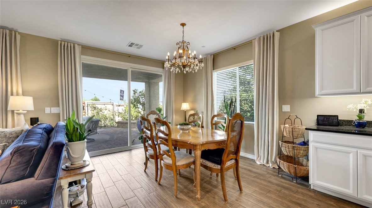1094 Langston Ranch Avenue Henderson, NV 89002 - Photo 29 of 70 Dining room with wood finish floors and a chandelier