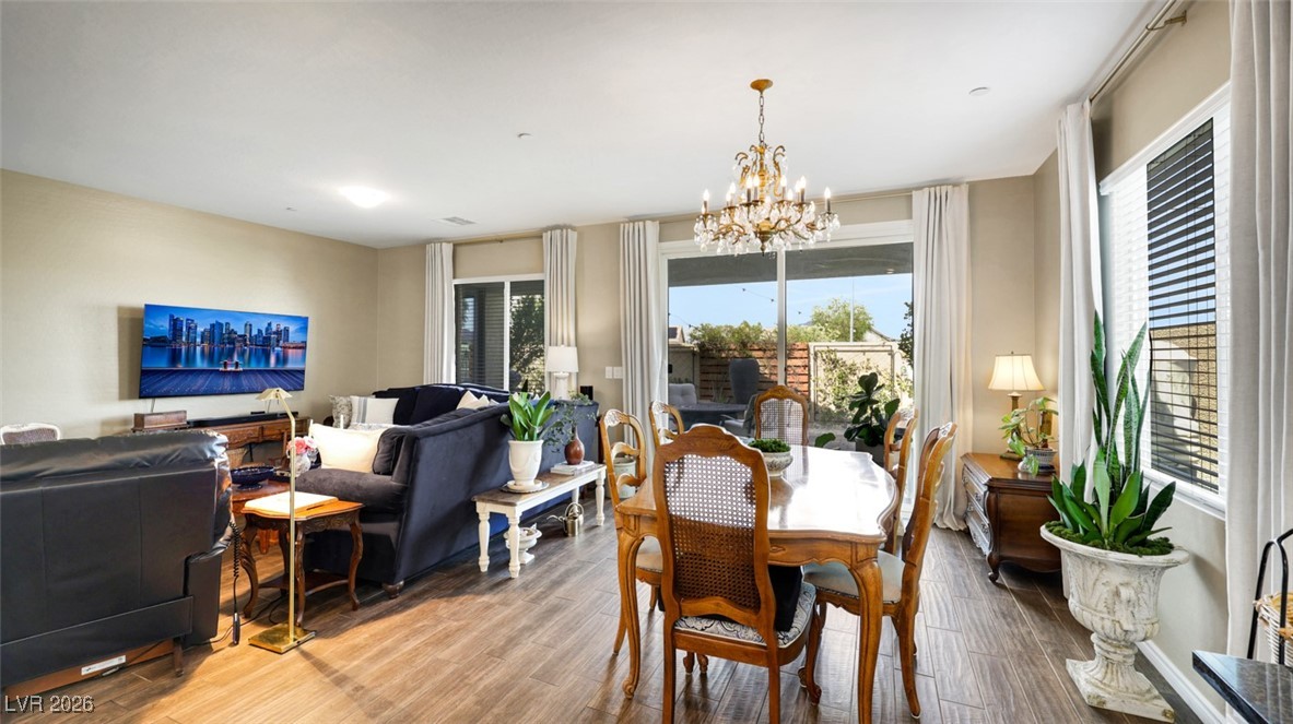 1094 Langston Ranch Avenue Henderson, NV 89002 - Photo 30 of 70 Dining room featuring a chandelier and wood finished floors