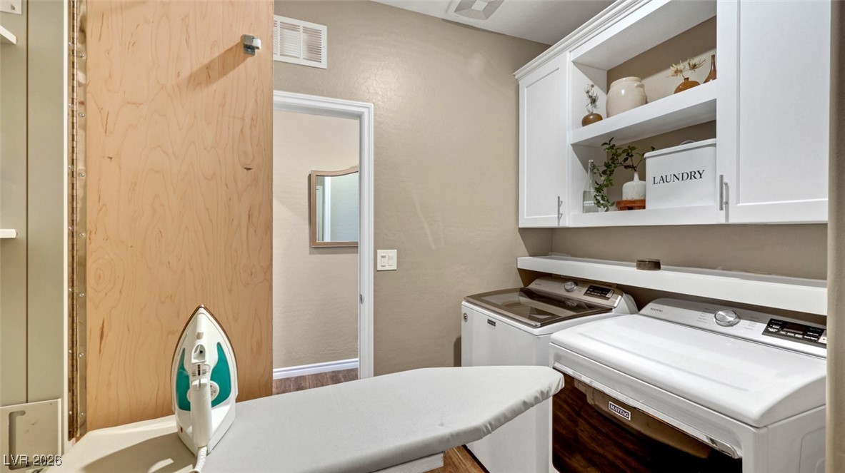 1094 Langston Ranch Avenue Henderson, NV 89002 - Photo 33 of 70 Washroom with washing machine and dryer and cabinet space