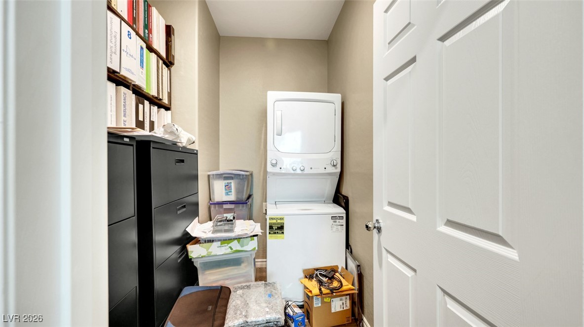 1094 Langston Ranch Avenue Henderson, NV 89002 - Photo 40 of 70 Laundry room with stacked washing machine and dryer