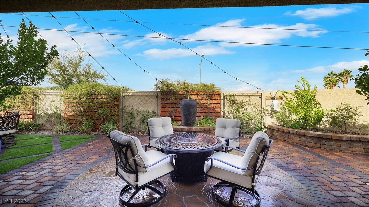1094 Langston Ranch Avenue Henderson, NV 89002 - Photo 50 of 70 Fenced backyard featuring a patio area and an outdoor fire pit