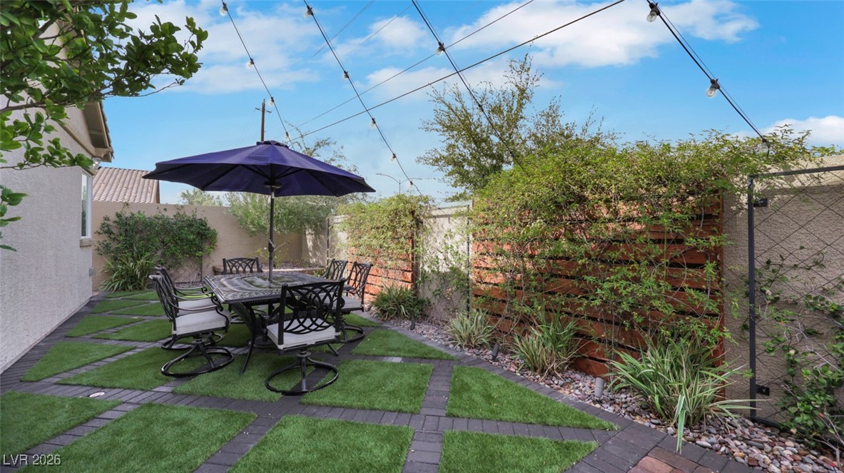 1094 Langston Ranch Avenue Henderson, NV 89002 - Photo 54 of 70 Fenced backyard with outdoor dining area and a patio