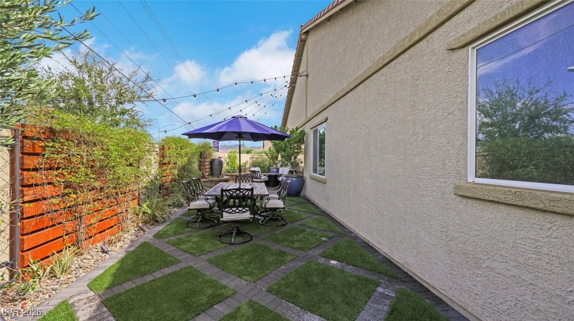 1094 Langston Ranch Avenue Henderson, NV 89002 - Photo 56 of 70 Fenced backyard featuring outdoor dining space and a patio